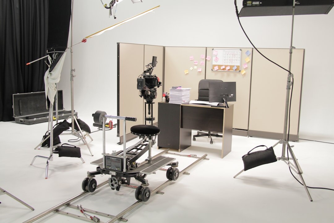 Wide shot of a television studio set with cameras and lighting rig