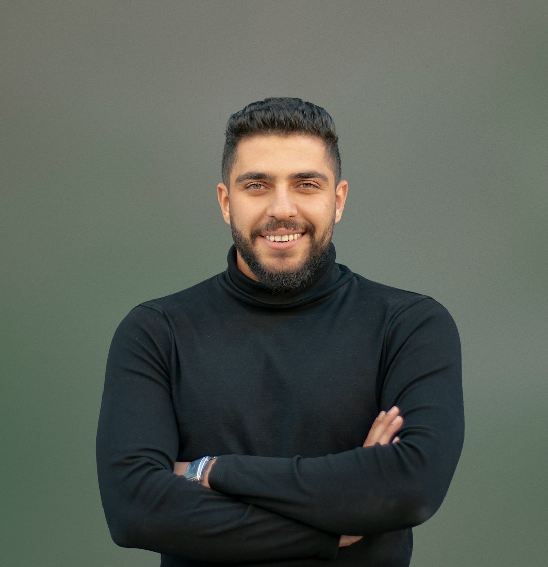 Turkish male broadcast instructor with beard smiling