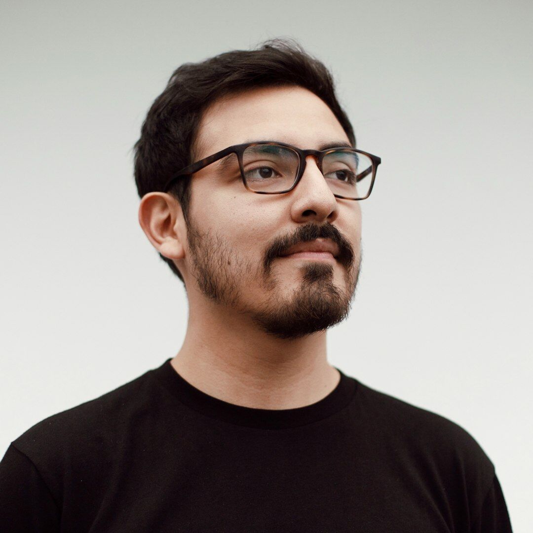 Turkish male video production instructor with glasses