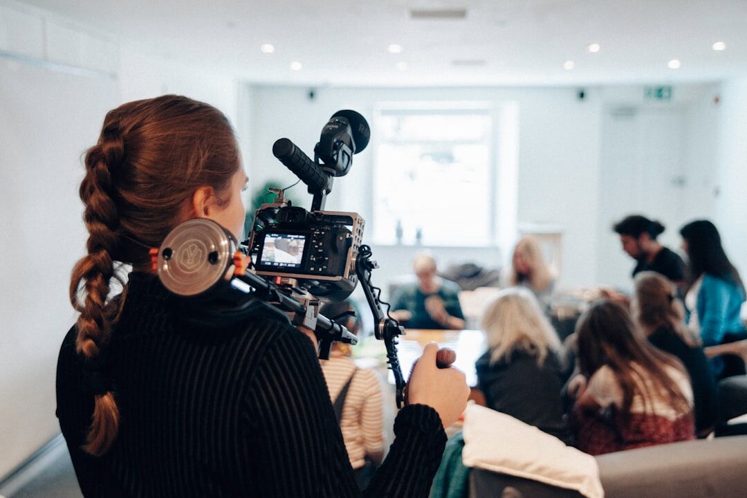 Turkish instructor teaching students how to use a video camera